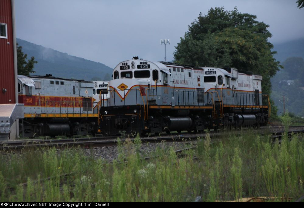 DL 2452, 2423, 405, 3642 behind the shop at daybreak